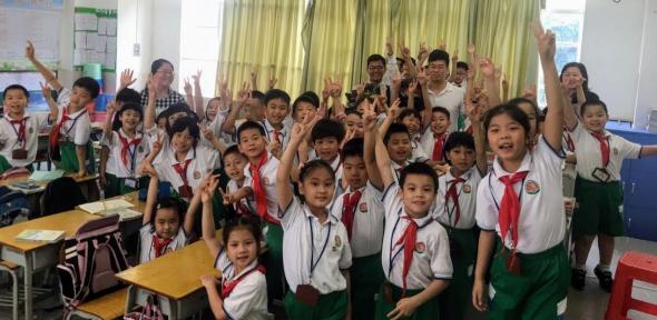 Ajay and Meng with year 2 students at Tianhe Hui Jing Elementary School, Guangzhou, China